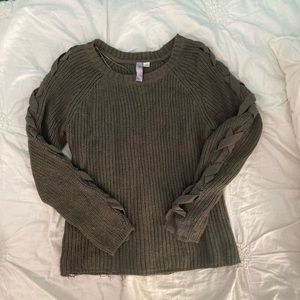 green sweater with detailed sleeves